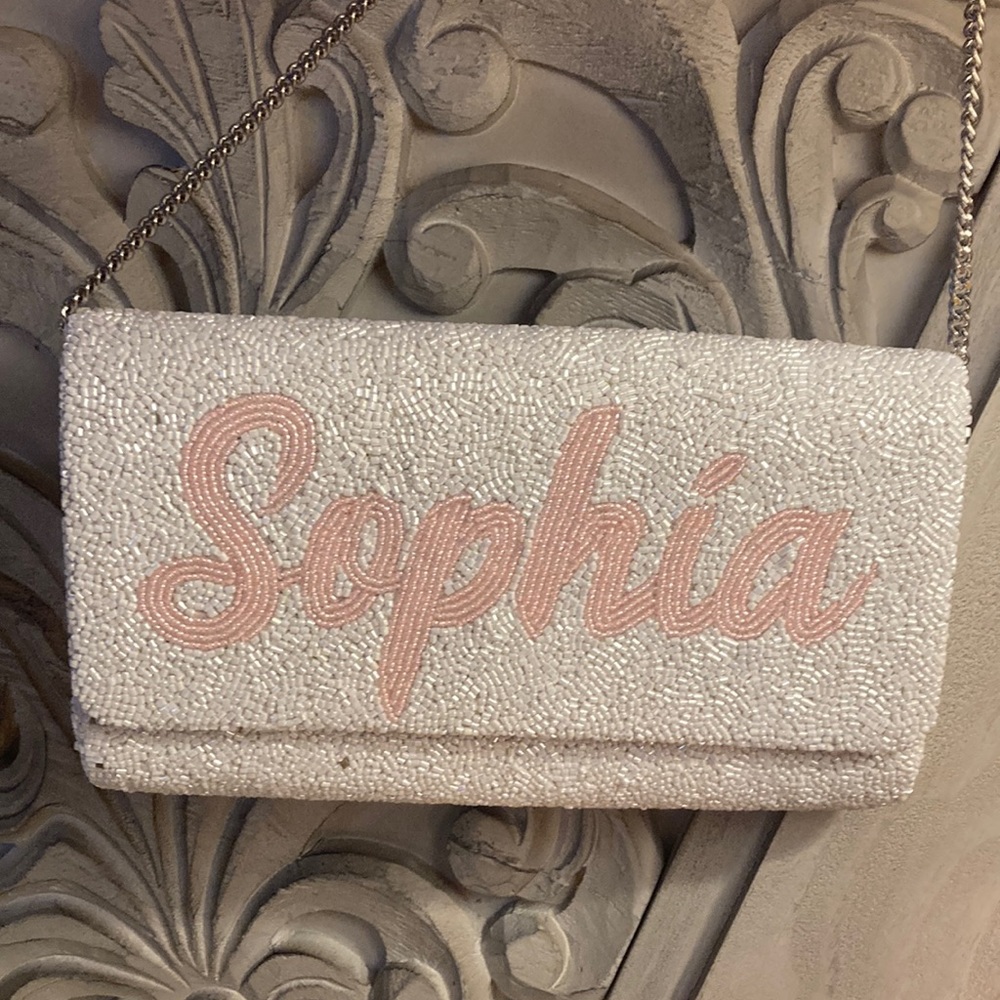 “Sophia” white & pink clutch w/ silver crossbody chain strap & magnetic closure
